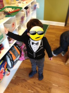 GQ toddler posing. Face covered to protect the innocent.