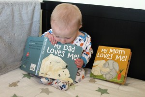 Very important morning reading in his crib :)